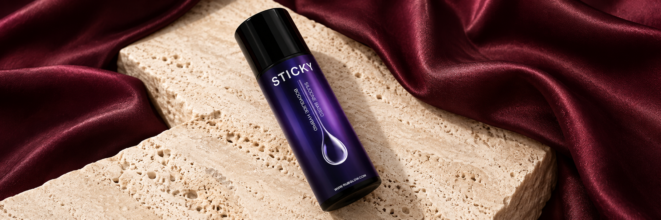 Lubricantes: selección de Elysium sobre telas color vino y fondo claro